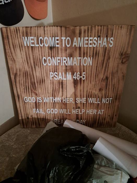 Scorched wooden welcome board printed for Ameesha's confirmation with the words of Psalm 46 verse 5