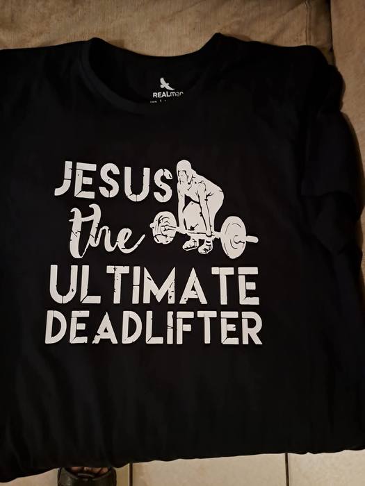 Black t-shirt printed Jesus the Ultimate Deadlifter with a weightlifter graphic